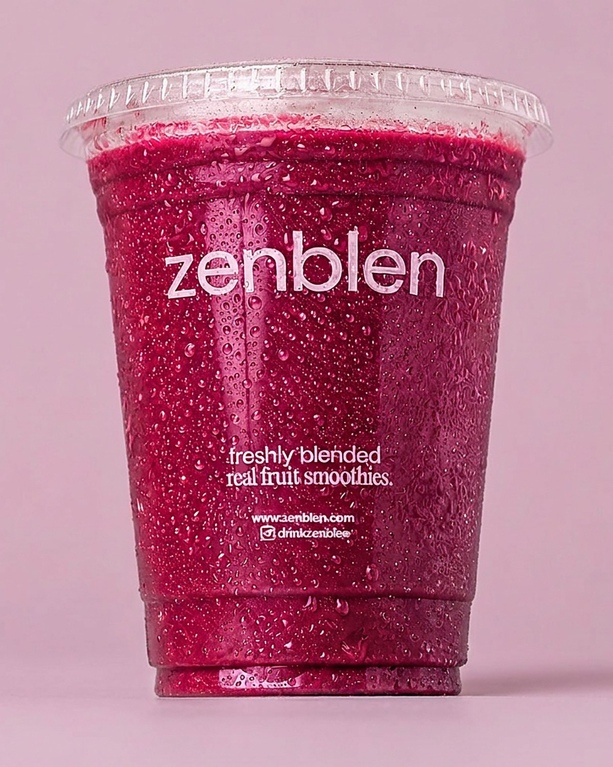 A Zenblen berry smoothie in a branded cup, freshly blended
