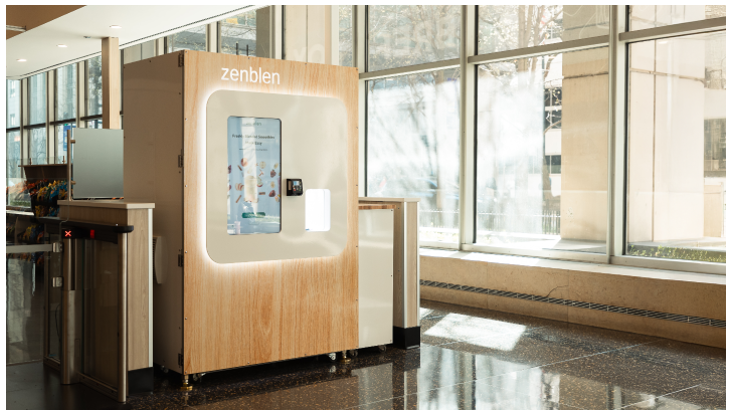 A Zenblen smoothie kiosk in a bright modern building lobby